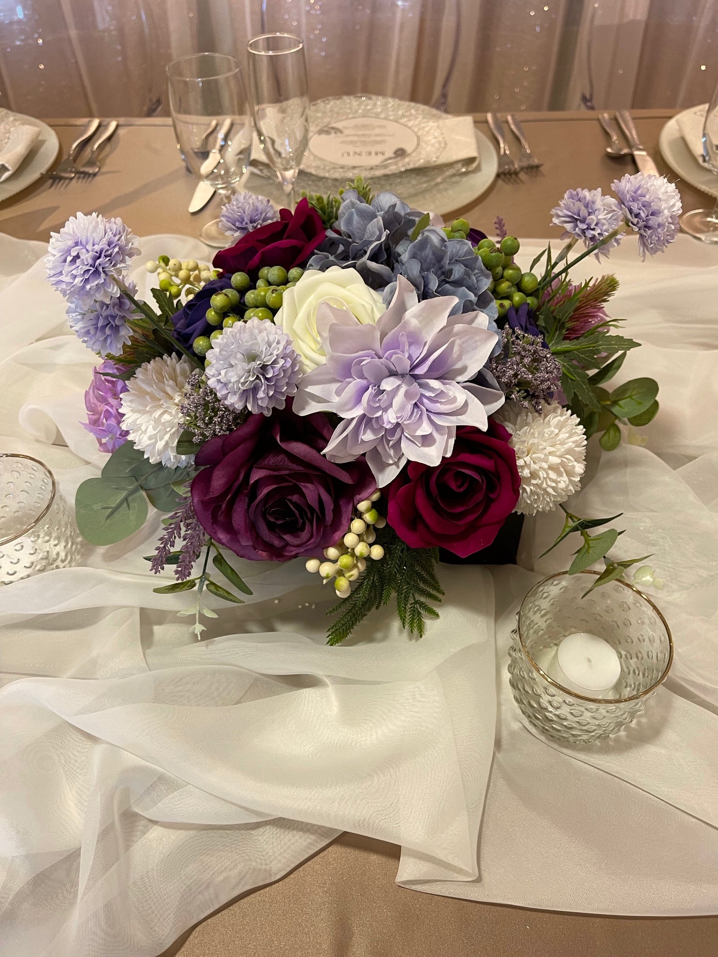 Rent a Rose- Centrepiece- Purple, Lavender, Fuchsia and white flowers-  Rent for five days for $20.00