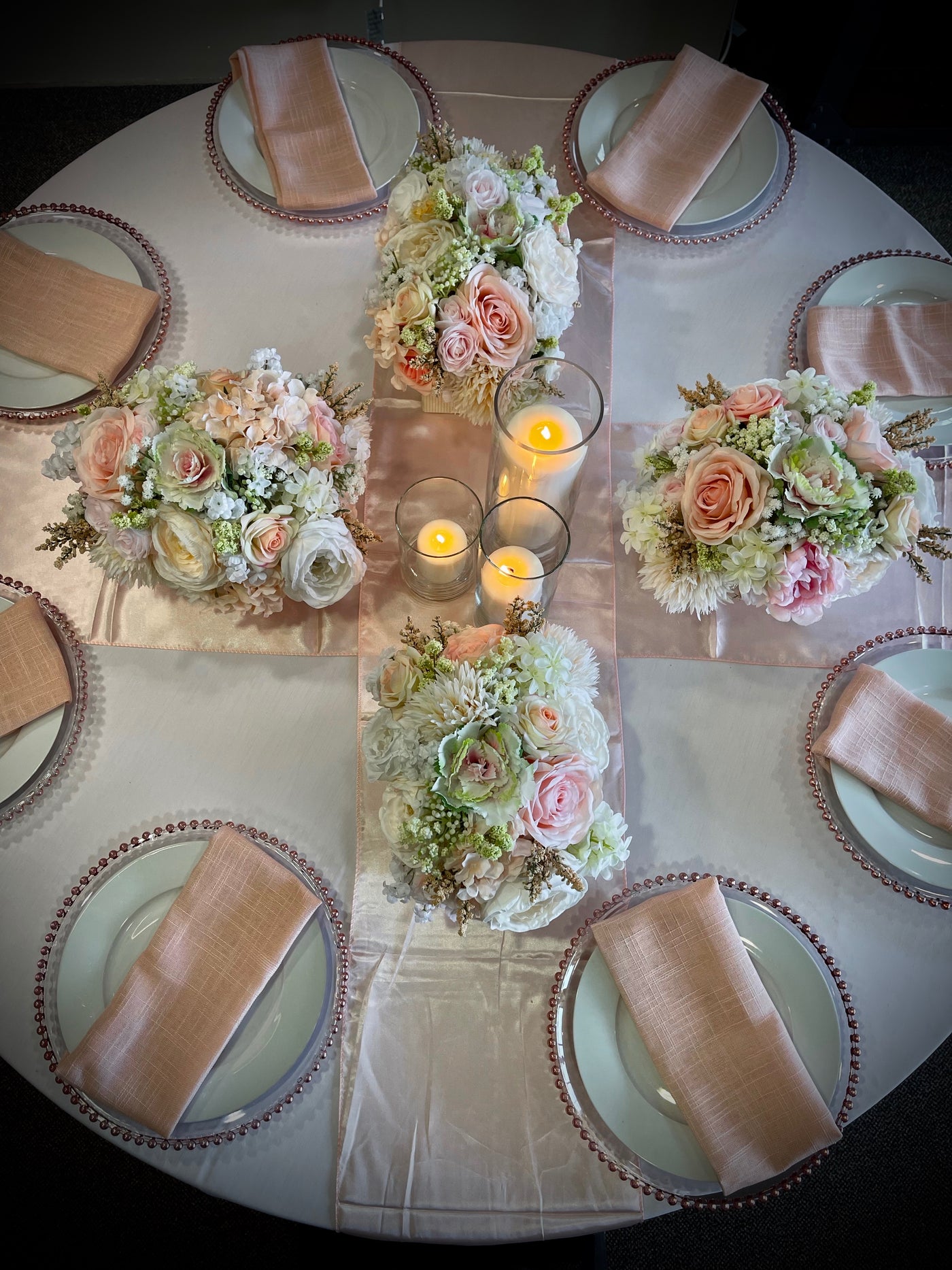 This soft pastel centrepiece is the perfect whisper of elegance featuring pale pink roses, blush dahlia, delicate white peonies, pale pink cabbage rose, white sweet peas, hydrangea, baby’s breath, and accented with miniature viburnum. Nestled in a pale pink box with 2 inch mini pearl border (L8”x 4”x H4”).