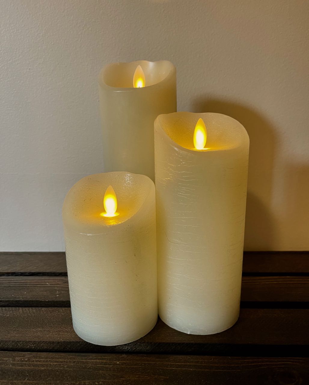 Rent A rose- trio of cream LED pillar candles of three different heights