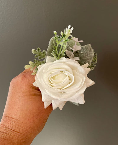 Boutonniere from Rent A rose- Single white rose flanked by sage Green Eucalyptus. Rent for Five days for $8.00