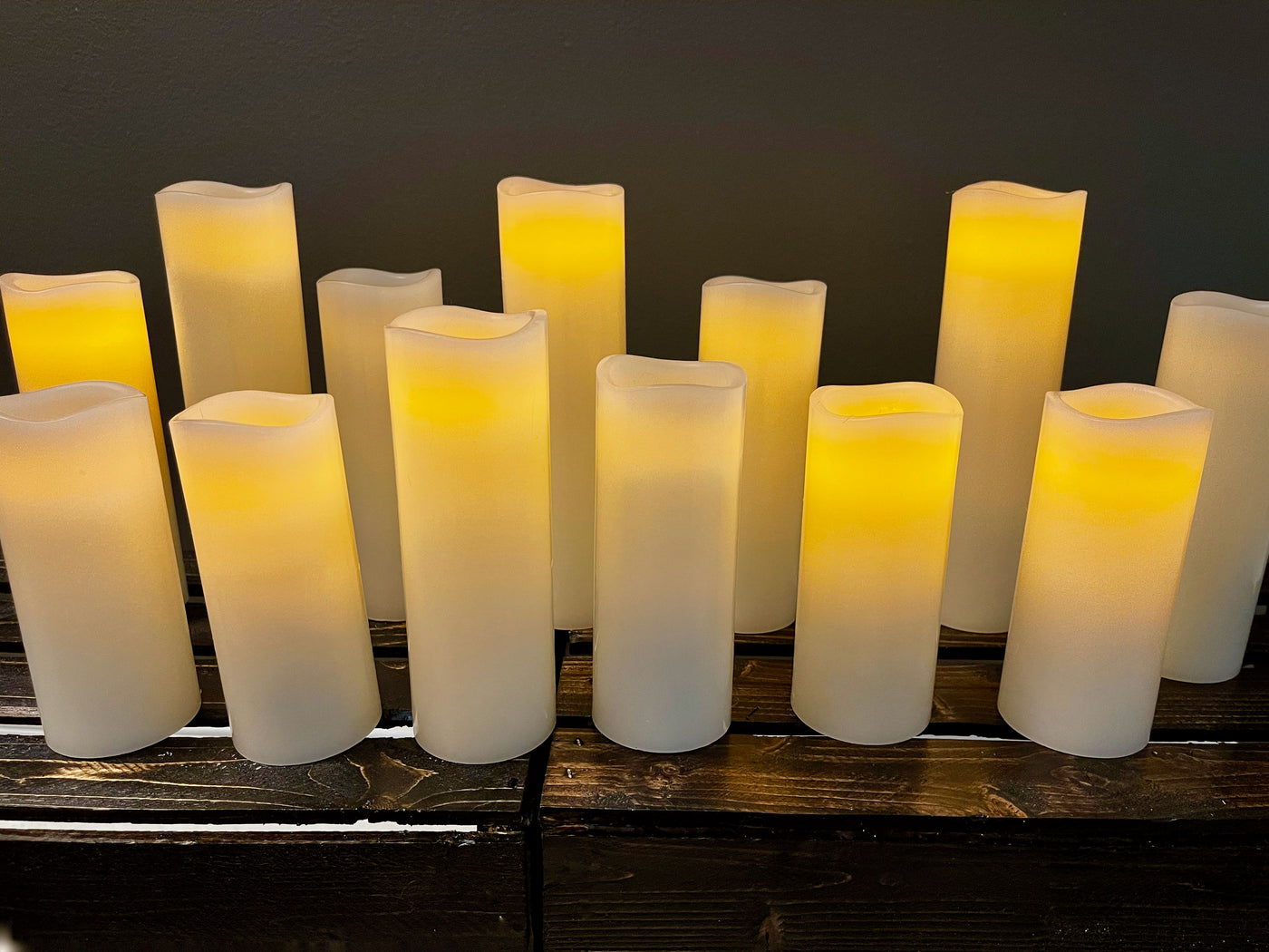 13 LED candles in three sizes (8", 6 1/4", 5") . This beautiful set of candles can be turned on and off with a push of a single button on the handy remote control. The set can also be programmed with one button touch on to stay lighted for 2, 4, 6, or 8 hours.