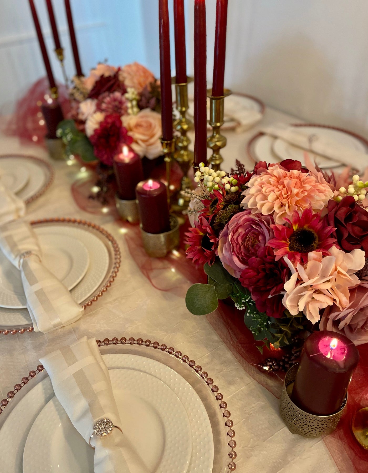 Rent a Rose- Centrepiece- Burgundy and pink flowers-  Rent for five days for $20.00.