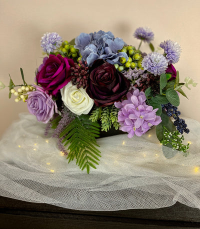 Rent a Rose- Centrepiece- Purple, Lavender, Fuchsia and white flowers-  Rent for five days for $54.00.