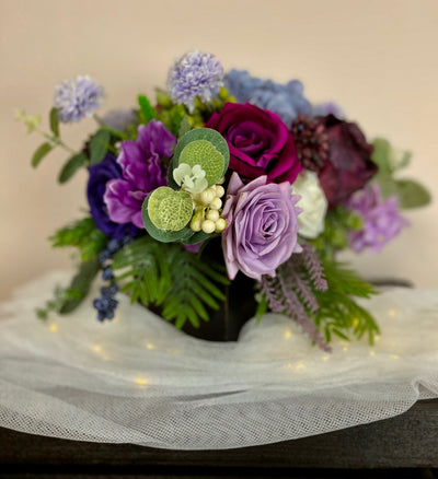 Rent a Rose- Centrepiece- Purple, Lavender, Fuchsia and white flowers-  Rent for five days for $54.00.