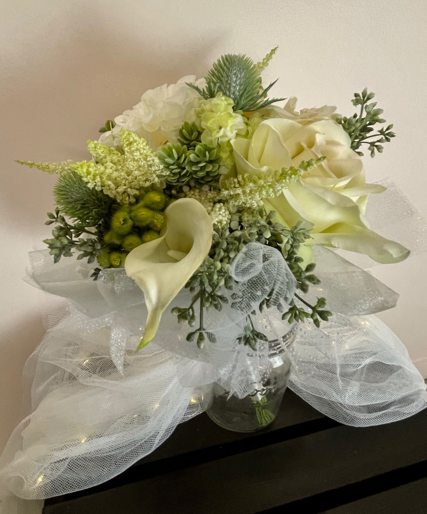 Flower Girl Bouquet in white and light green. Rents for $35.00 for five days