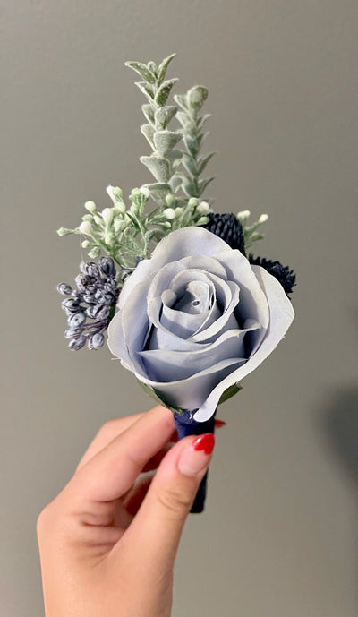 Rent A Rose -light blue boutonniere tied with Navy ribbon