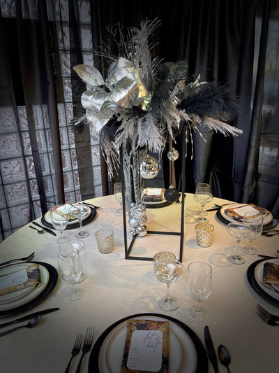 Rent a Rose- Black and silver tall rectangular centrepiece with feathers. Rent for $99.00