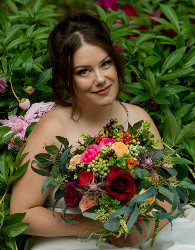 Rent a Rose- bridal Bouquet- Scarlet, apricot, fuchsia with Green foliage and berries