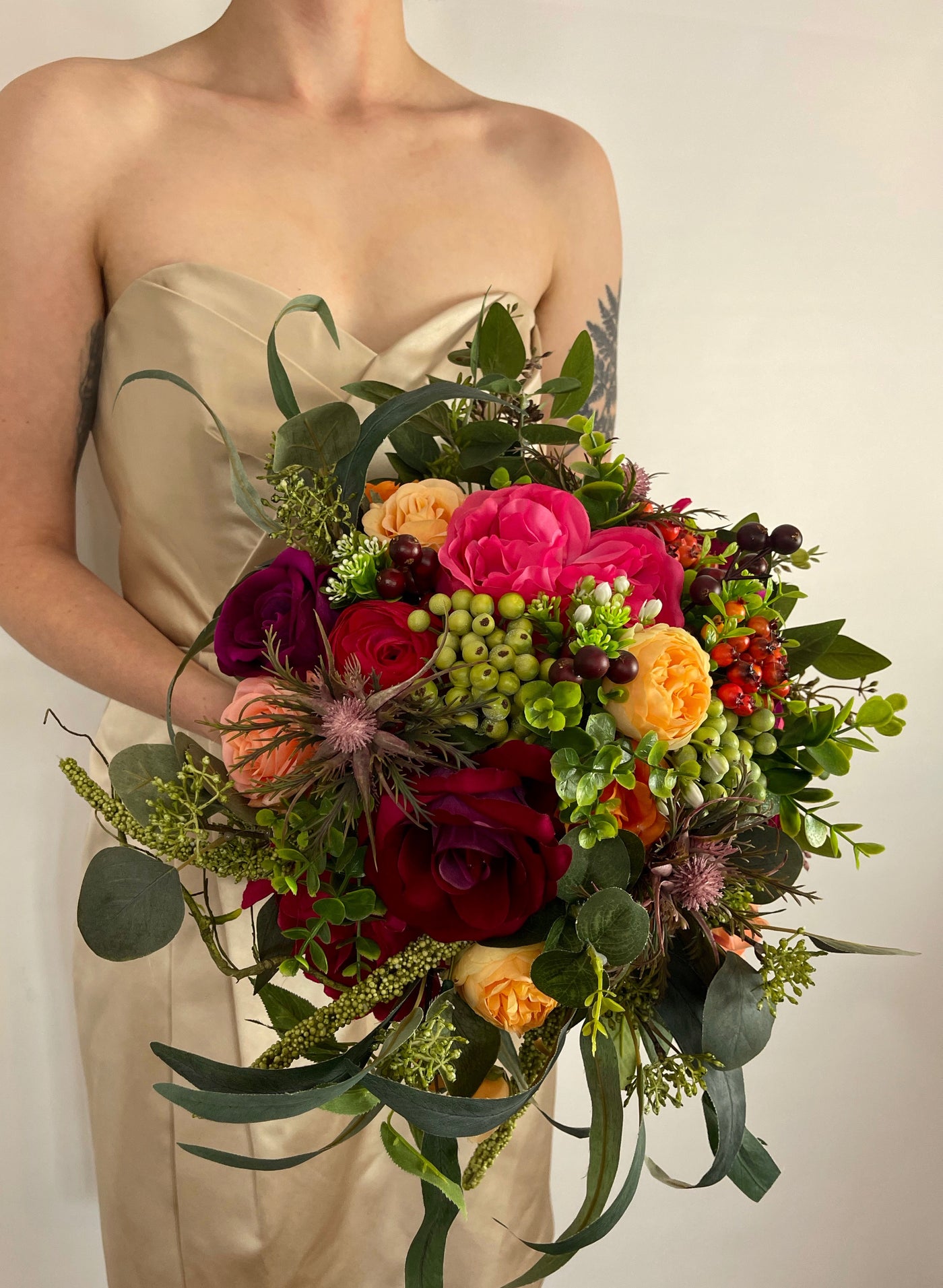 Rent a Rose-Bridesmaid Bouquet- Jewel toned rich colors of Burgundy orange, fuchsia make up this oversized bouquet.Rent for five days for $69.00