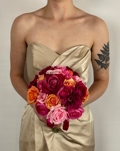 Rent a Rose-Compact Colorful  Bridal Bouquet in Fuchsia and orange. Availabe to rent for three weeks. Especially designed for tropical destination weddings.