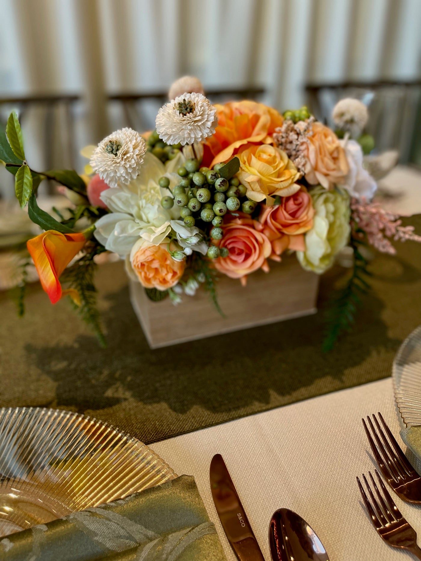 Rent a Rose- Centrepiece- orange, white and pale green flowers-  Rent for five days for $54.00.