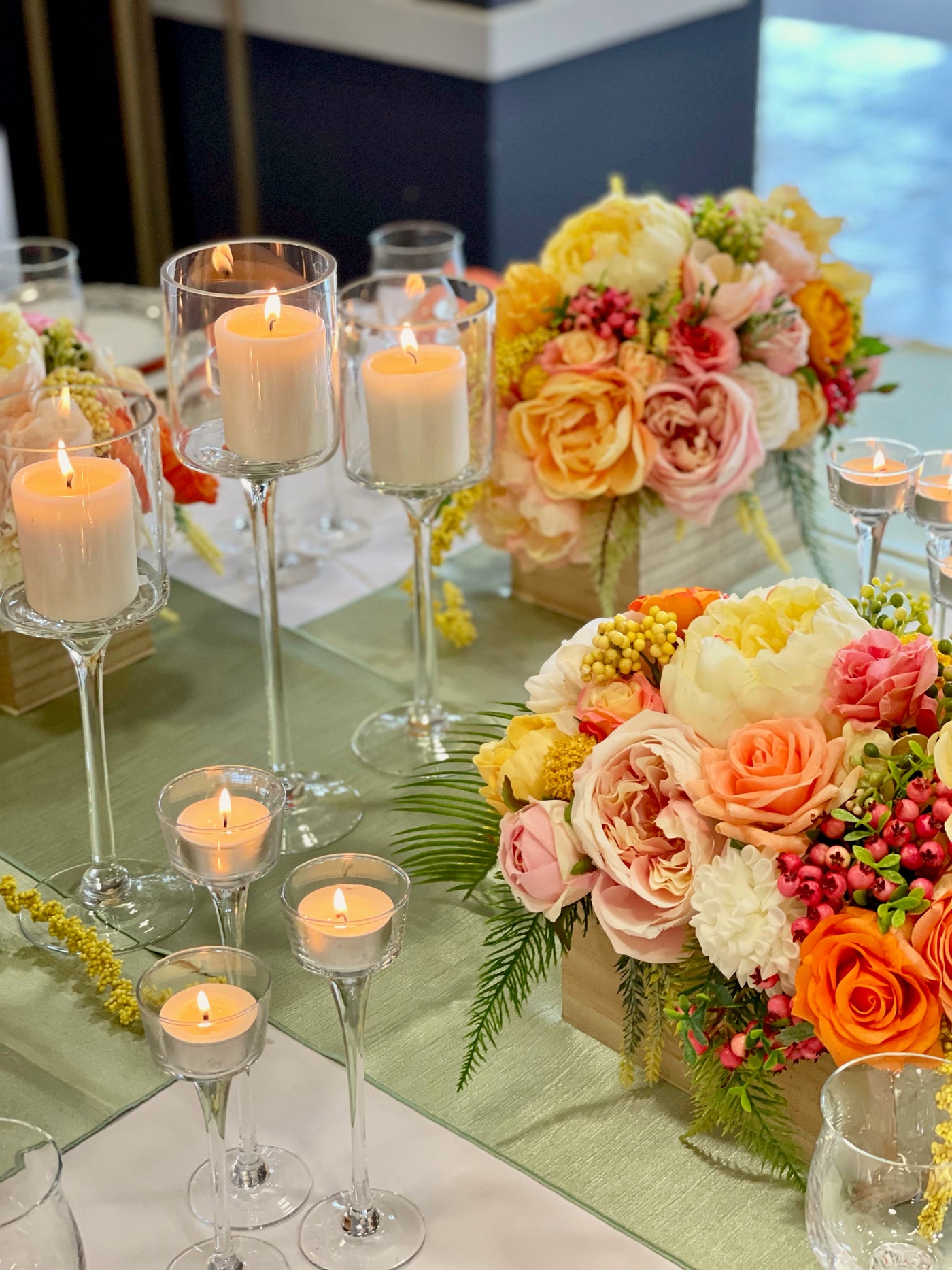 Rent a Rose- Centrepiece- orange, yellow and pink flowers-  Rent for five days for $54.00.