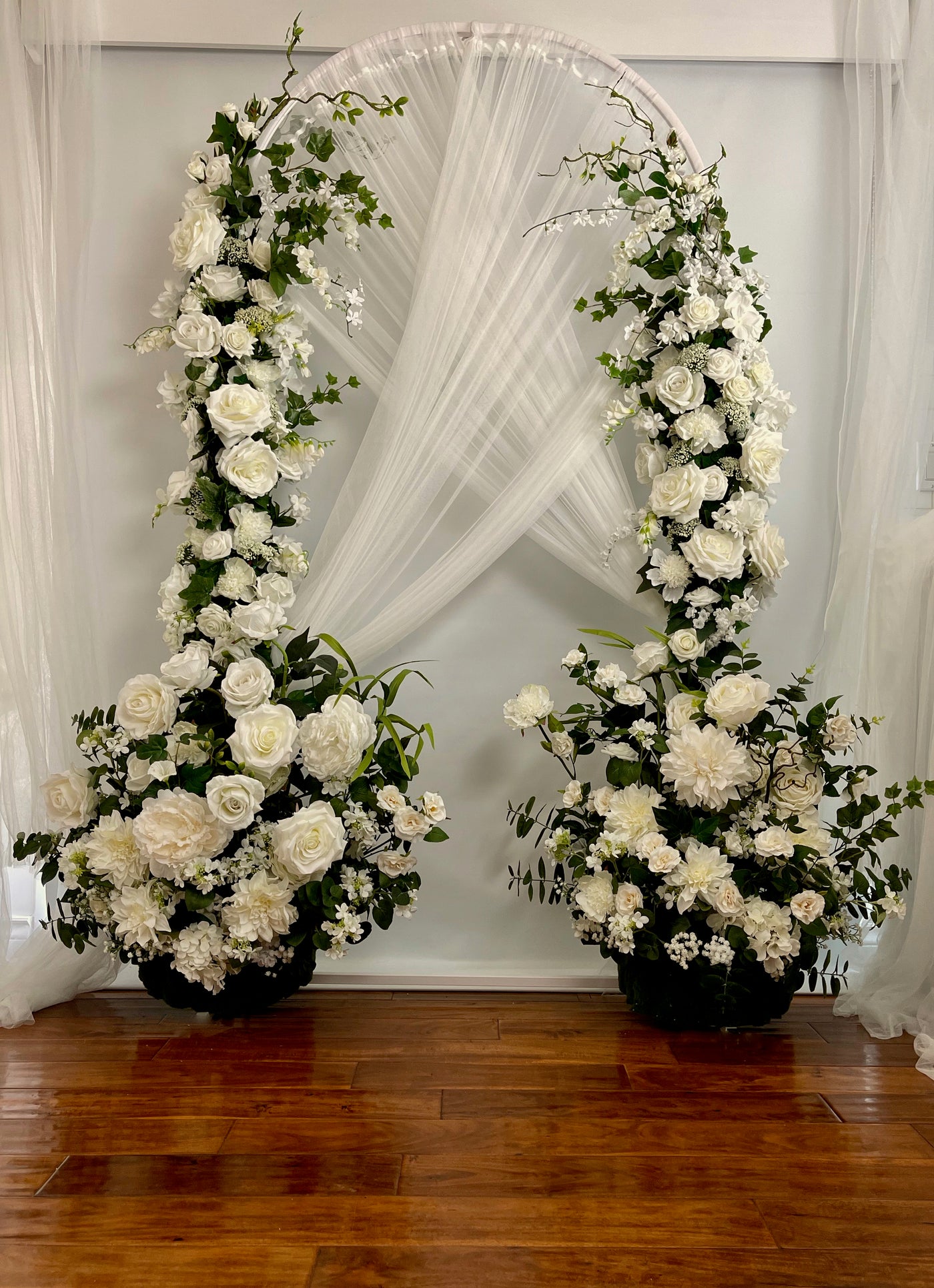 Create the perfect dreamy atmosphere for your wedding by incorporating these crisp white florals into your decor nuptials. There are five separate pieces to this wedding arch, and each piece can be rented separately. The total price to rent all five pieces is $525.00.