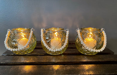 Rent a Rose- Wedding Decor-Adorable diamond patterned yellow glass votive with a handle made of wood beads. The price to rent a single votive including candle is $3.00
